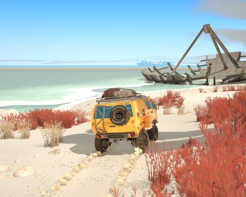 A screenshot from Caravan SandWitch. We see the back of a yellow van as it drives down a sandy beach towards what appears to be a fallen satellite.